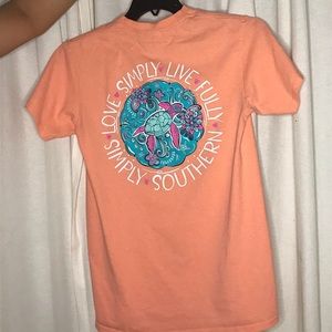 Simply Southern women’s orange short sleeve shirt.